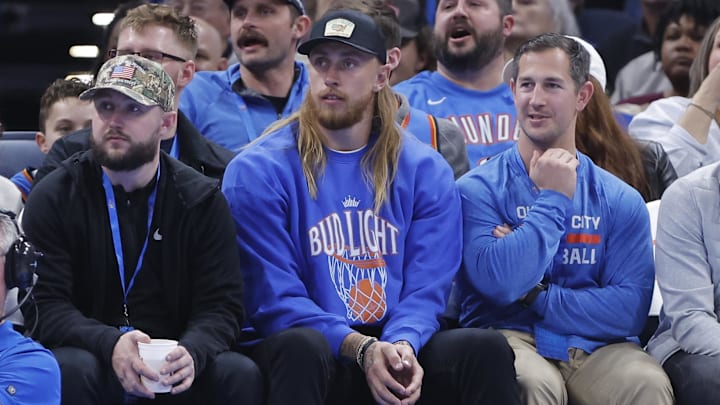 Mar 3, 2025; Oklahoma City, Oklahoma, USA; San Francisco 49's tight end George Kittle watches a game between the Houston Rockets and Oklahoma City Thunder during the second half at Paycom Center. Mandatory Credit: Alonzo Adams-Imagn Images