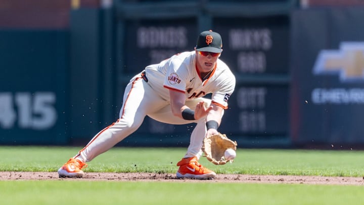 Apr 4, 2025; San Francisco, California, USA; San Francisco Giants shortstop Tyler Fitzgerald (49) fields a grounder during the first inning against the Seattle Mariners at Oracle Park. 