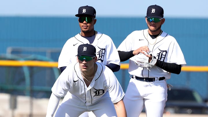 Detroit Tigers infield prospects Izaac Pacheco, Cristian Santana, and Manuel Sequera field grounders at the Tigers facility in Lakeland, Fla., in 2022