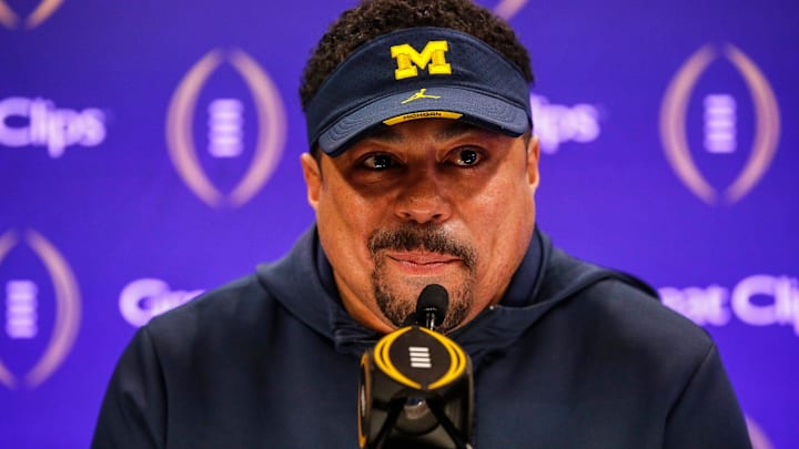 Michigan running backs coach Mike Hart speaks during Media Day at George R. Brown Convention Center