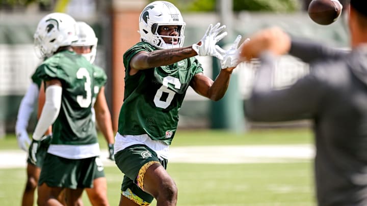 Michigan State's Nick Marsh catches a pass during the first day of football camp on Tuesday, July 30, 2024, in East Lansing.