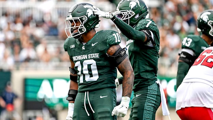 Michigan State's Wayne Matthews III, left, celebrates with Nikai Martinez after a tackle against Youngstown State during the third quarter on Saturday, Sept. 13, 2025, at Spartan Stadium in East Lansing.