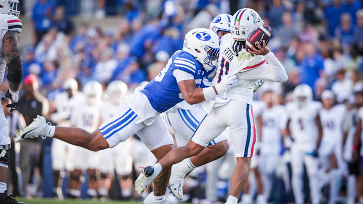 BYU linebacker Aisea Moa pressures Arizona quarterback Noah Fifita as BYU takes down the Wildcats 41-19
