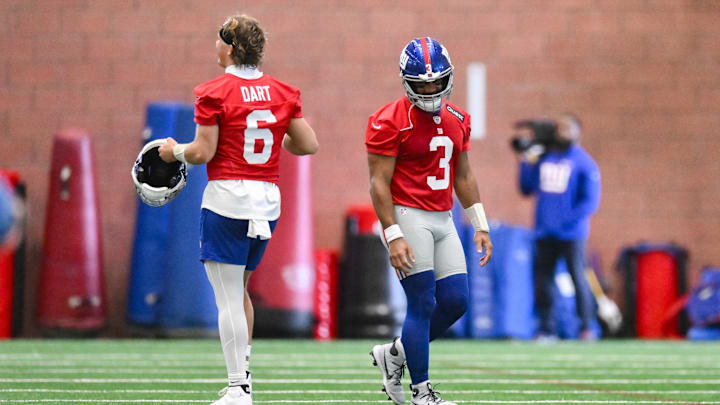 Jun 17, 2025; East Rutherford, NJ, USA; New York Giants quarterback Jaxson Dart (6) and quarterback Russell Wilson (3) interact during minicamp at Quest Diagnostics Training Center.