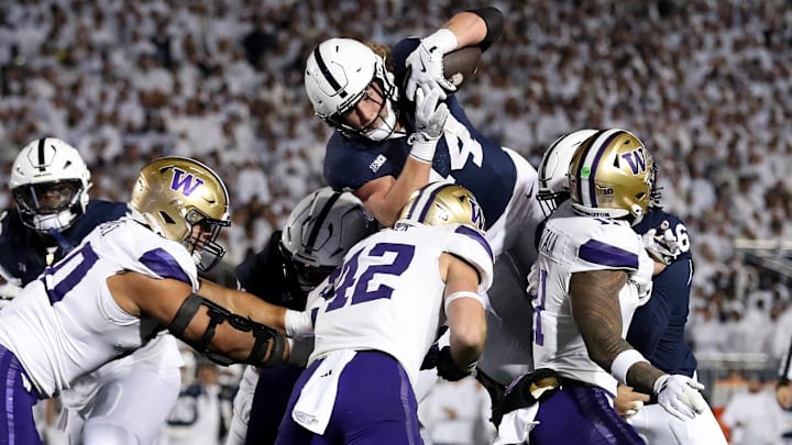 Penn State all-everything player Tyler Warren goes in for a first-half touchdown against the Huskies in State College, Pennsylvania. 