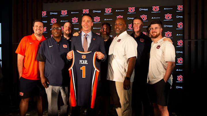 Steven Pearl poses with his coaching staff as he is introduced as the new Auburn men’s basketball head coach.