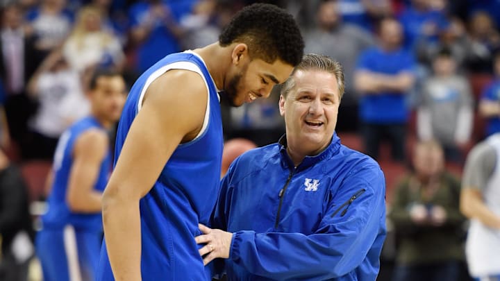 Mar 18, 2015; Louisville, KY, USA; Kentucky Wildcats forward Karl-Anthony Towns (12) and Kentucky Wildcats head coach John Calipari talk during practice before the second round of the 2015 NCAA Tournament at KFC Yum! Center. Mandatory Credit: Jamie Rhodes-Imagn Images