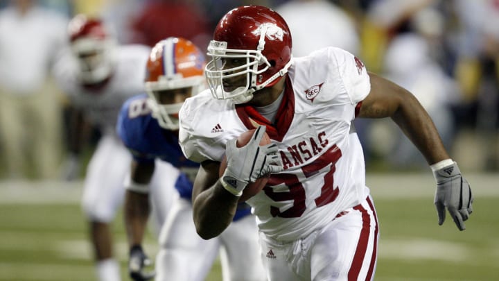 Arkansas Razorbacks defensive end returns an interception for a touchdown during the 3rd quarter against the Florida Gators in the SEC Championship game at the Georgia Dome in Atlanta. Arkansas Razorbacks defensive end returns an interception for a touchdown during the 3rd quarter against the Florida Gators in the SEC Championship game at the Georgia Dome in Atlanta.