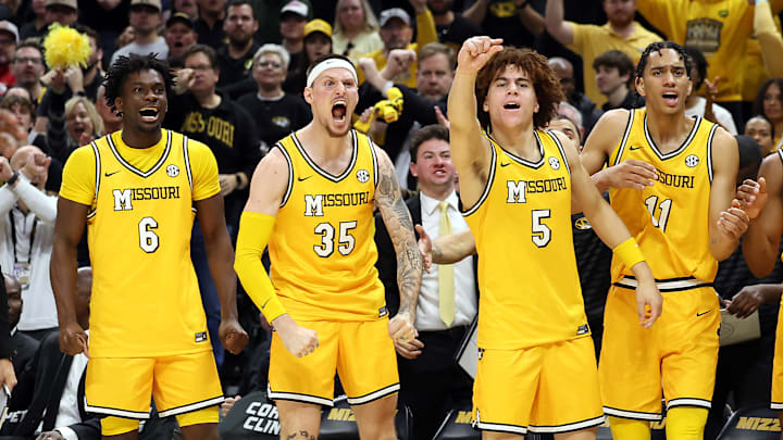 Missouri Tigers players Annor Boateng (6), Jacob Crews (35), T.O. Barrett (5), and Trent Pierce (11) celebrate from the bench in a win against the Kansas Jayhawks.