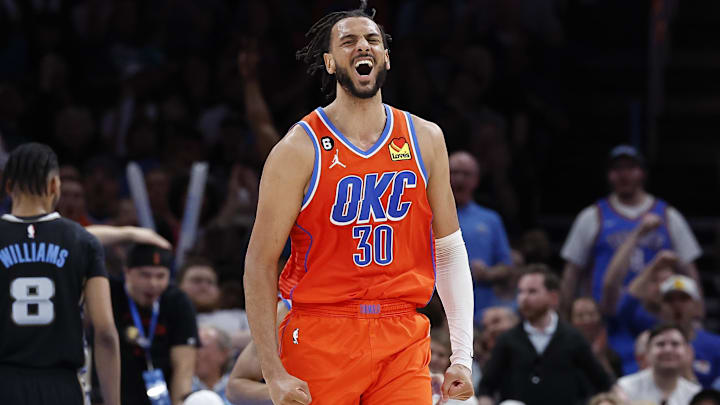 Apr 9, 2023; Oklahoma City, Oklahoma, USA;  Oklahoma City Thunder center Olivier Sarr (30) celebrates during the second half against the Memphis Grizzlies at Paycom Center. Oklahoma City won 115-100. Mandatory Credit: Alonzo Adams-Imagn Images