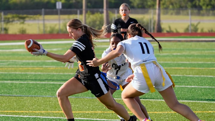 Spruce Creek's Jillian Truax reaches for extra yardage during the 2024 District 5-2A Flag Football Championship game with New Smyrna Beach last year. Truax last week completed 19 of 21 passes for 310 yards and four TDs and rushed eight times for 100 yards and a score to guide the Hawks past Pine Ridge, 33-8. Spruce Creek's Jillian Truax reaches for extra yardage during the 2024 District 5-2A Flag Football Championship game with New Smyrna Beach last year. Truax last week completed 19 of 21 passes for 310 yards and four TDs and rushed eight times for 100 yards and a score to guide the Hawks past Pine Ridge, 33-8.