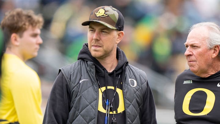 Oregon offensive coordinator Will Stein, left, former Oregon defensive coordinator Nick Aliotti and former Oregon coach Rich Brooks talk before the game as the Fighting Ducks face off against Mighty Oregon in the Oregon Ducks spring game on April 26, 2025, at Autzen Stadium in Eugene. Oregon offensive coordinator Will Stein, left, former Oregon defensive coordinator Nick Aliotti and former Oregon coach Rich Brooks talk before the game as the Fighting Ducks face off against Mighty Oregon in the Oregon Ducks spring game on April 26, 2025, at Autzen Stadium in Eugene.