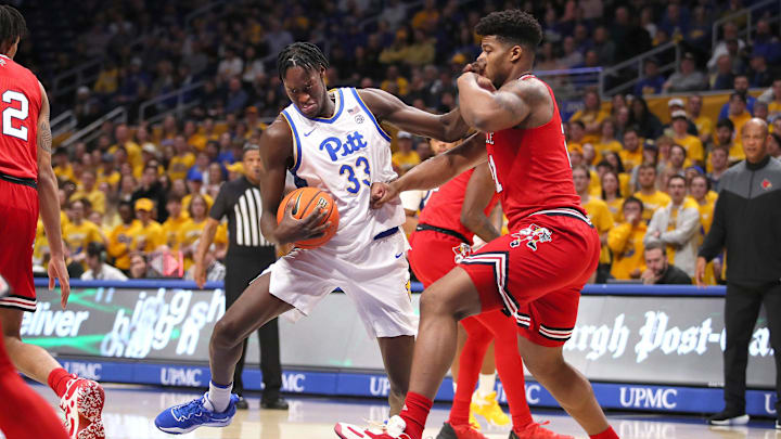 Pittsburgh Panthers Federiko Federiko (33) gets fouled by Louisville Cardinals Sydney Curry (21)