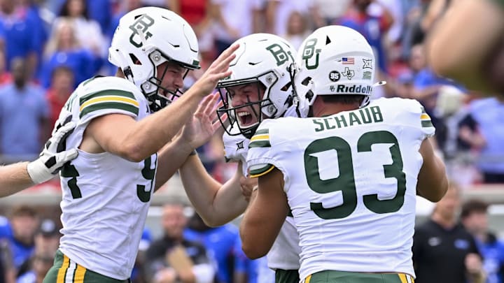Sep 6, 2025; Dallas, Texas, USA; Baylor Bears punter Palmer Williams (94) and long snapper Dylan Schaub celebrates after place kicker Connor Hawkins (96) makes a game winning field goal to defeat the SMU Mustangs during the second overtime at Gerald J. Ford Stadium. Mandatory Credit: Jerome Miron-Imagn Images