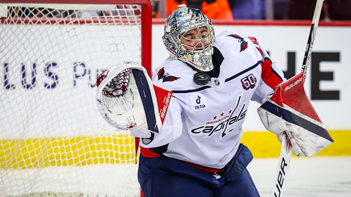 Jan 28, 2025; Calgary, Alberta, CAN; Washington Capitals goaltender Logan Thompson (48) makes a save against the Calgary Flames during the second period at Scotiabank Saddledome. Mandatory Credit: Sergei Belski-Imagn Images