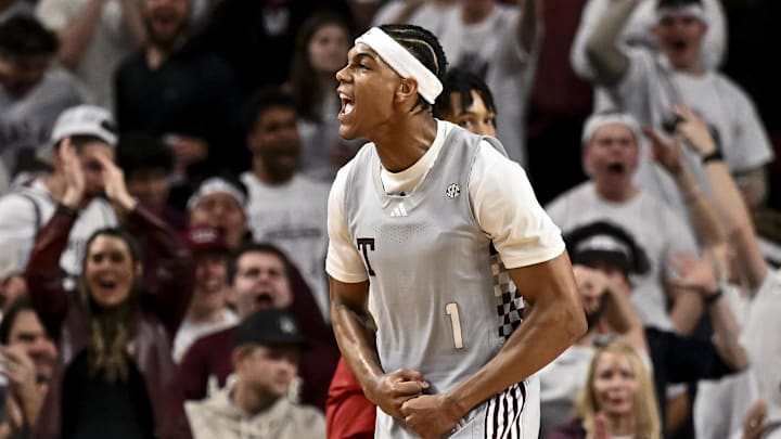 Feb 15, 2025; College Station, Texas, USA; Texas A&M Aggies guard Zhuric Phelps (1) reacts after dunking the ball during the second half against the Arkansas Razorbacks at Reed Arena. Mandatory Credit: Maria Lysaker-Imagn Images 