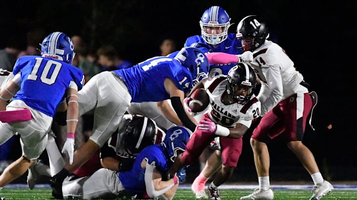 Ballard attempts to get free from the grasp of Oldham County during the first half of their game, Friday, Oct. 17 2025 in Buckner Ky. Ballard attempts to get free from the grasp of Oldham County during the first half of their game, Friday, Oct. 17 2025 in Buckner Ky.
