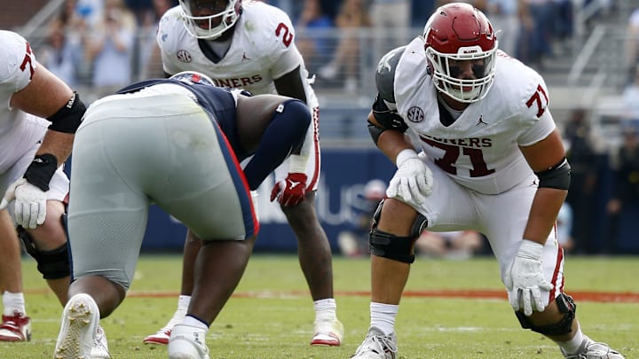 Oklahoma offensive tackle Logan Howland prepares before a snap against Ole Miss. Oklahoma offensive tackle Logan Howland prepares before a snap against Ole Miss.