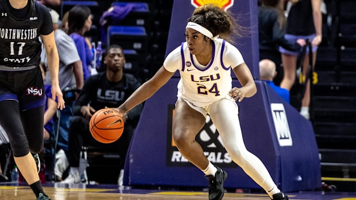 Nov 8, 2024; Baton Rouge, Louisiana, USA; LSU Lady Tigers guard Aneesah Morrow (24) dribbles against Northwestern State Lady Demons guard Carla Celaya (17) during the first half at Pete Maravich Assembly Center. Mandatory Credit: Stephen Lew-Imagn Images Nov 8, 2024; Baton Rouge, Louisiana, USA; LSU Lady Tigers guard Aneesah Morrow (24) dribbles against Northwestern State Lady Demons guard Carla Celaya (17) during the first half at Pete Maravich Assembly Center. Mandatory Credit: Stephen Lew-Imagn Images