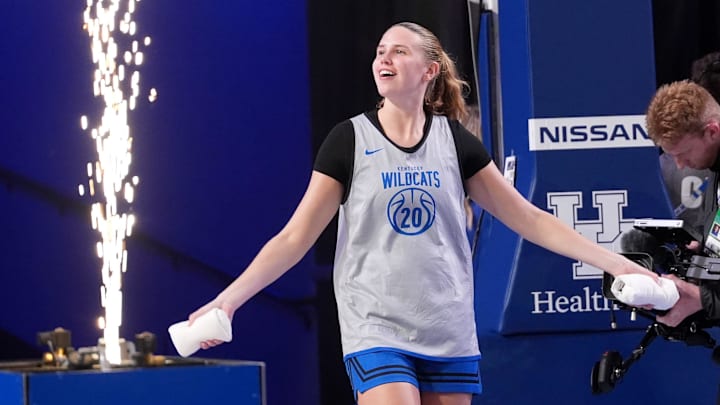 Kentucky’s Kaelyn Carroll comes out onto the court as the Blue and White team scrimmaged each other in Memorial Coliseum Friday night.
Oct. 17, 2025