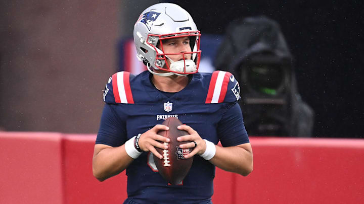 New England Patriots quarterback Bailey Zappe (4) warms up before a game against the Carolina Panthers at Gillette Stadium.