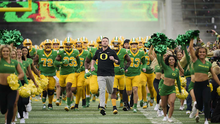 Nov 9, 2024; Eugene, Oregon, USA; Oregon Ducks head coach Dan Lanning leads his team before the start of a game against the Maryland Terrapins at Autzen Stadium. Mandatory Credit: Troy Wayrynen-Imagn Images