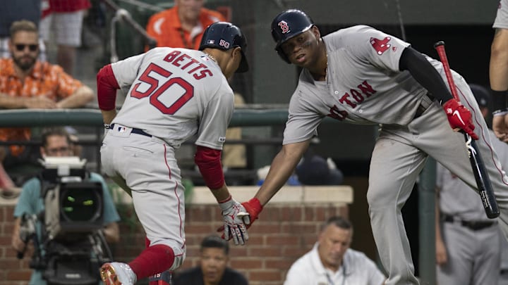 Boston Red Sox right fielder Mookie Betts (50) celebrates with third baseman Rafael Devers (11) after hitting a two run home run against the Baltimore Orioles at Oriole Park at Camden Yards. Boston Red Sox right fielder Mookie Betts (50) celebrates with third baseman Rafael Devers (11) after hitting a two run home run against the Baltimore Orioles at Oriole Park at Camden Yards.