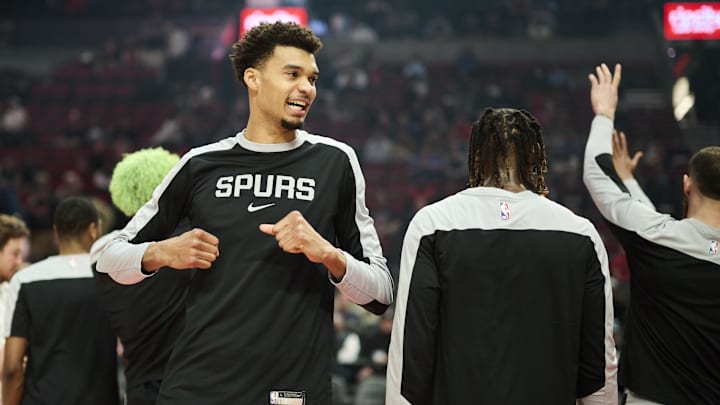 Dec 13, 2024; Portland, Oregon, USA; San Antonio Spurs center Victor Wembanyama (1) greets teammates during pregame announcements against the Portland Trail Blazers at Moda Center.