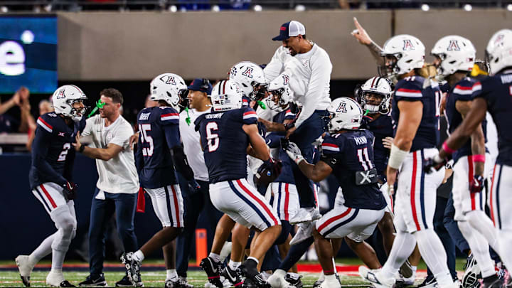 Oct 11, 2025; Tucson, Arizona, USA; Arizona Wildcats defensive back Dalton Johnson (43) celebrates an interception he caught from the Brigham Young Cougars with his team during the third quarter of the game at Arizona Stadium. Mandatory Credit: Aryanna Frank-Imagn Images