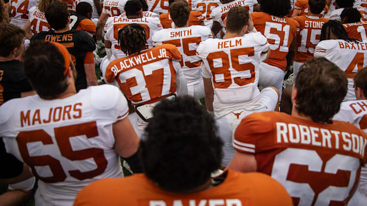 The Texas Longhorns gather on the field following the Longhorns' spring Orange and White game at Darrell K Royal Texas Memorial Stadium in Austin, Texas, April 20, 2024.