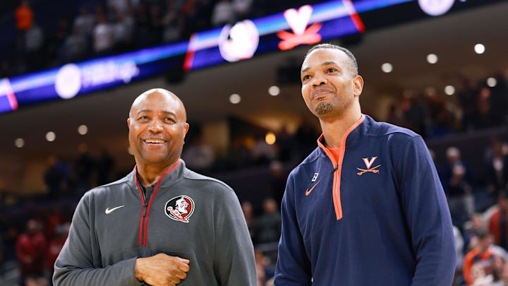 Mar 4, 2025; Charlottesville, Virginia, USA; Virginia Cavaliers head coach Ron Sanchez and Florida State Seminoles head coach Leonard Hamilton before the game at John Paul Jones Arena. Mandatory Credit: Emily Faith Morgan-Imagn Images
