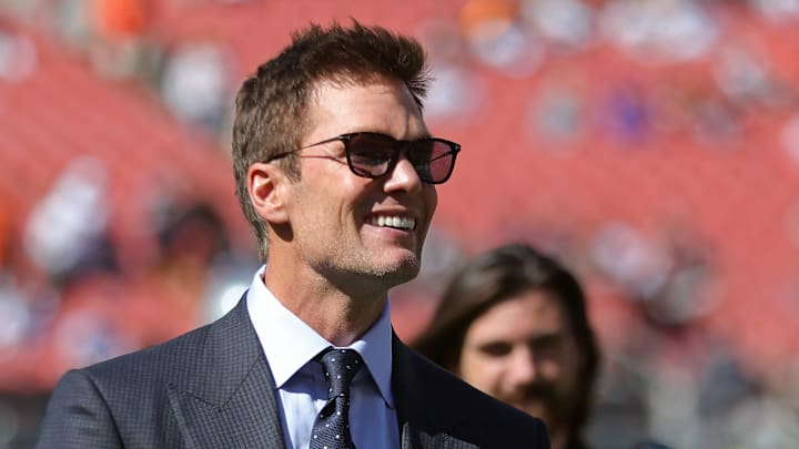 NFL legend Tom Brady is all smiles before an NFL football game at Huntington Bank Field, Sunday, Sept. 8, 2024, in Cleveland, Ohio.