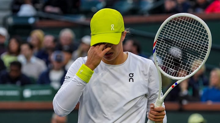 Iga Swiatek reacts to a point by Mirra Andreeva during the WTA semifinals at the BNP Paribas Open in Indian Wells, Calif., Friday, March 14, 2025.