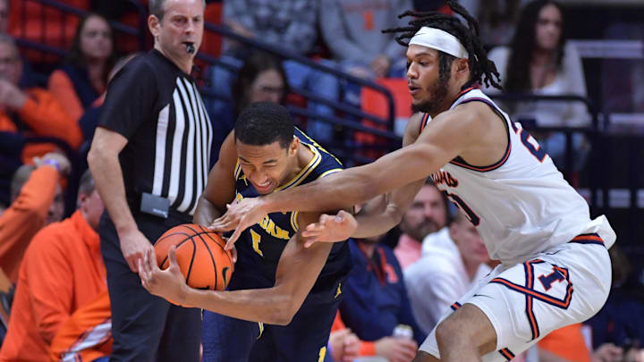 Feb 13, 2024; Champaign, Illinois, USA; Illinois Fighting Illini forward Ty Rodgers (20) pressures