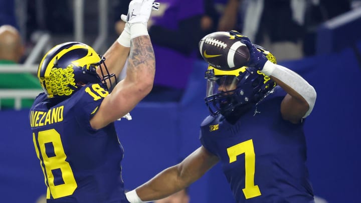 Jan 8, 2024; Houston, TX, USA; Michigan Wolverines running back Donovan Edwards (7) celebrates with tight end Colston Loveland (18) after scoring a touchdown against the Washington Huskies during the first quarter in the 2024 College Football Playoff national championship game at NRG Stadium. Mandatory Credit: Mark J. Rebilas-USA TODAY Sports