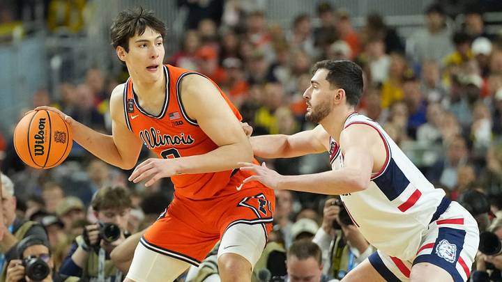 Apr 4, 2026; Indianapolis, IN, USA; Illinois Fighting Illini forward David Mirkovic (0) is defended by Connecticut Huskies forward Alex Karaban (11) in the first half during a semifinal of the Final Four of the men's 2026 NCAA Tournament at Lucas Oil Stadium. Mandatory Credit: Robert Deutsch-Imagn Images Apr 4, 2026; Indianapolis, IN, USA; Illinois Fighting Illini forward David Mirkovic (0) is defended by Connecticut Huskies forward Alex Karaban (11) in the first half during a semifinal of the Final Four of the men's 2026 NCAA Tournament at Lucas Oil Stadium. Mandatory Credit: Robert Deutsch-Imagn Images