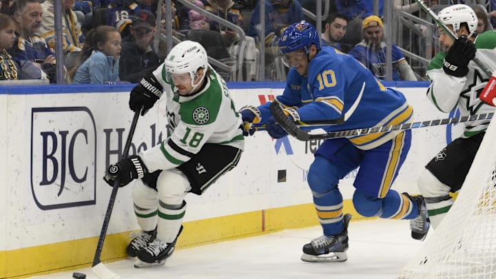 Jan 25, 2025; St. Louis, Missouri, USA; Dallas Stars center Sam Steel (18) controls the puck against St. Louis Blues center Brayden Schenn (10) during the first period at Enterprise Center. Mandatory Credit: Jeff Le-Imagn Images