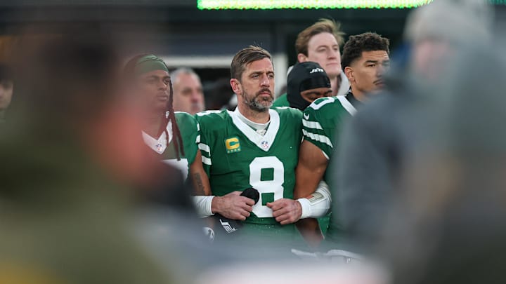 Jan 5, 2025; East Rutherford, New Jersey, USA; New York Jets quarterback Aaron Rodgers (8) stands with teammates during the national anthem before the game against the Miami Dolphins at MetLife Stadium. Mandatory Credit: Vincent Carchietta-Imagn Images Jan 5, 2025; East Rutherford, New Jersey, USA; New York Jets quarterback Aaron Rodgers (8) stands with teammates during the national anthem before the game against the Miami Dolphins at MetLife Stadium. Mandatory Credit: Vincent Carchietta-Imagn Images