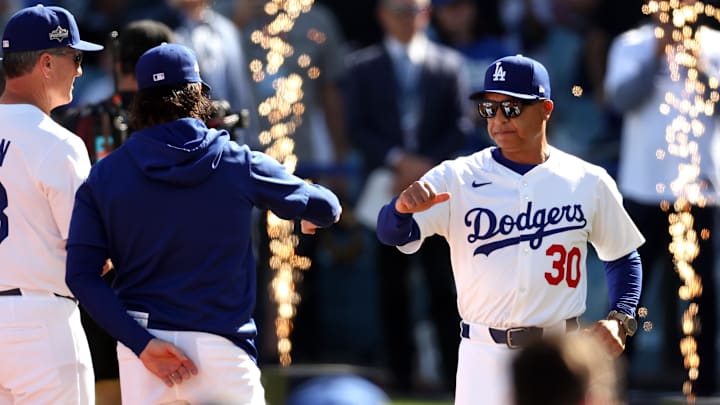 Oct 16, 2025; Los Angeles, California, USA; Los Angeles Dodgers manager Dave Roberts (30) is introduced before game three against the Milwaukee Brewers in the NLCS round for the 2025 MLB playoffs at Dodger Stadium. Mandatory Credit: Kiyoshi Mio-Imagn Images Oct 16, 2025; Los Angeles, California, USA; Los Angeles Dodgers manager Dave Roberts (30) is introduced before game three against the Milwaukee Brewers in the NLCS round for the 2025 MLB playoffs at Dodger Stadium. Mandatory Credit: Kiyoshi Mio-Imagn Images