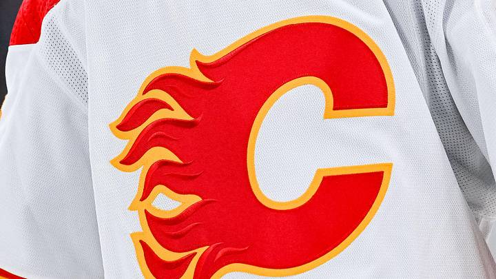 Dec 12, 2022; Montreal, Quebec, CAN; View of a Calgary Flames logo on a jersey worn by the member of the team during the second period at Bell Centre. Mandatory Credit: David Kirouac-Imagn Images