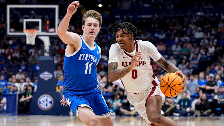 Alabama guard Labaron Philon (0) bolts past Kentucky guard Travis Perry (11) during the second half of a Southeastern Conference tournament quarterfinal game at Bridgestone Arena in Nashville, Tenn., Friday, March 14, 2025.