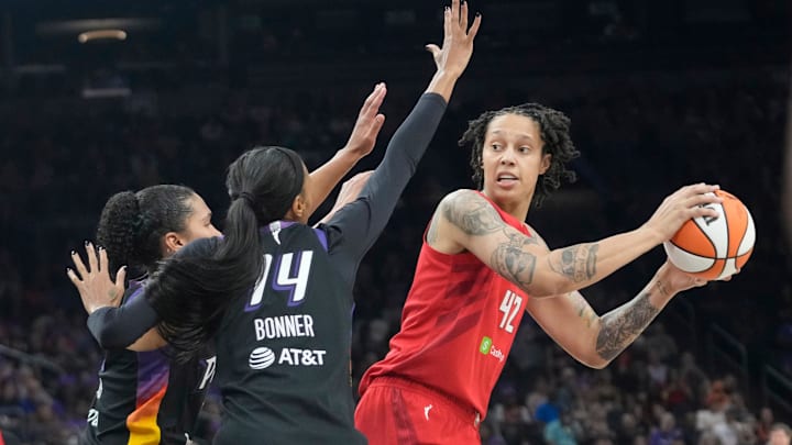 Atlanta Dream center Brittney Griner (42) is defended by Phoenix Mercury forwards Alyssa Thomas (25) and DeWanna Bonner (14) during the second quarter at PHX Arena Aug 10, 2025.