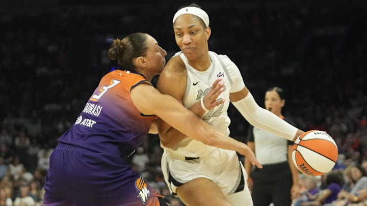Phoenix Mercury guard Diana Taurasi defends against Wilson during the first quarter at Footprint Center.