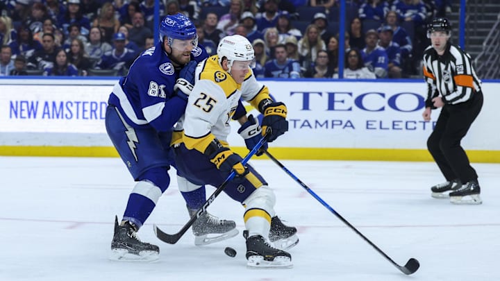 Mar 29, 2026; Tampa, Florida, USA; Nashville Predators right wing Joakim Kemell (25) controls the puck from Tampa Bay Lightning defenseman Erik Cernak (81) in the second period at Benchmark International Arena. Mandatory Credit: Nathan Ray Seebeck-Imagn Images