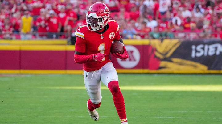 Sep 28, 2025; Kansas City, Missouri, USA; Kansas City Chiefs wide receiver Xavier Worthy (1) runs the ball against the Baltimore Ravens during the game at GEHA Field at Arrowhead Stadium. Mandatory Credit: Denny Medley-Imagn Images
