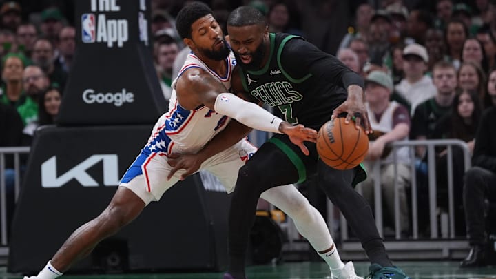 Apr 28, 2026; Boston, Massachusetts, USA; Philadelphia 76ers forward Paul George (8) defends against Boston Celtics guard Jaylen Brown (7) in the second quarter during game five of the first round of the 2026 NBA Playoffs at TD Garden. Mandatory Credit: David Butler II-Imagn Images