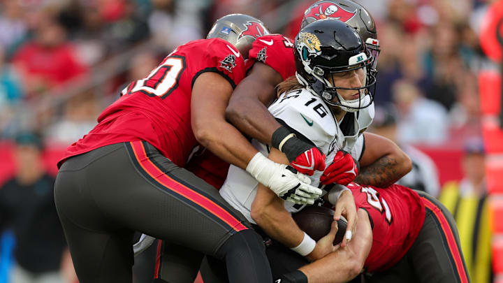 Dec 24, 2023; Tampa, Florida, USA; Jacksonville Jaguars quarterback Trevor Lawrence (16) is sacked Dec 24, 2023; Tampa, Florida, USA; Jacksonville Jaguars quarterback Trevor Lawrence (16) is sacked