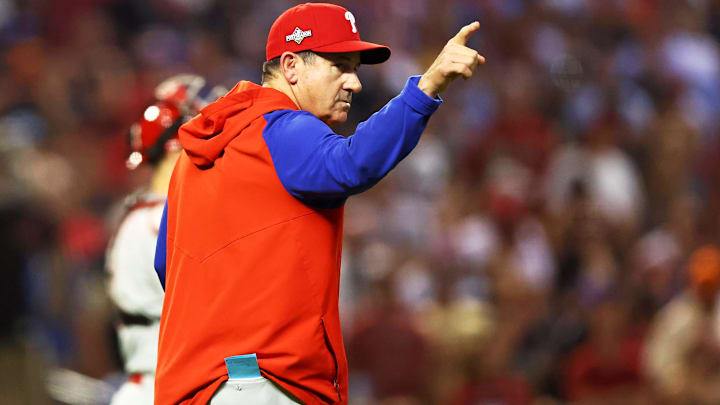 Philadelphia Phillies manager Rob Thomson signals to the bullpen during a game at Chase Field.