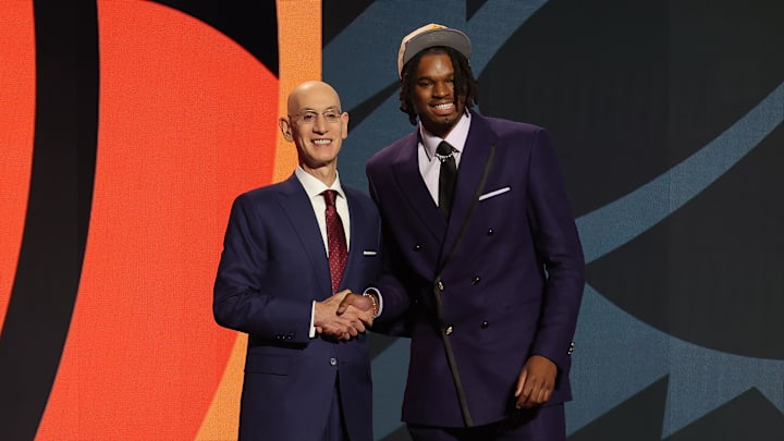 Jun 26, 2024; Brooklyn, NY, USA; DaRon Holmes ll poses for photos with NBA commissioner Adam Silver after being selected in the first round by the Phoenix Suns in the 2024 NBA Draft at Barclays Center. Mandatory Credit: Brad Penner-Imagn Images