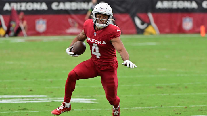 Sep 24, 2023; Glendale, Arizona, USA; Arizona Cardinals wide receiver Rondale Moore (4) runs the ball in the first half against the Dallas Cowboys at State Farm Stadium. Sep 24, 2023; Glendale, Arizona, USA; Arizona Cardinals wide receiver Rondale Moore (4) runs the ball in the first half against the Dallas Cowboys at State Farm Stadium.